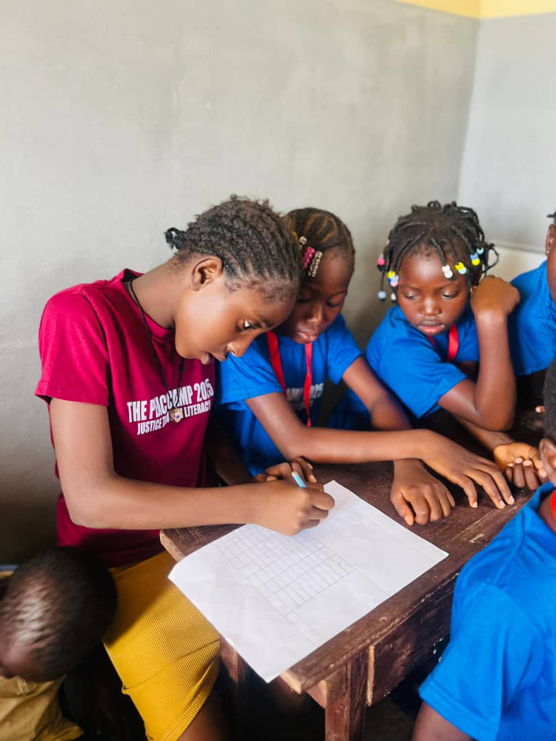 Children reading at a JTL camp